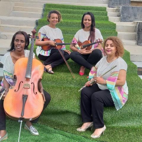 Ethio Classic Quartet by Abiyot Four women sitting on stairs holding a range of instruments