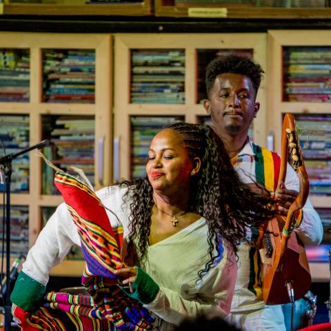 Ethiocolor by Miki Mac Two musicians performing on stage with traditional instruments